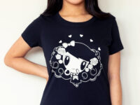 A smiling girl wear a Day of the Dead Lolligag tee