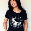 A girl smiling wearing a Lolligag Day of the Dead shirt