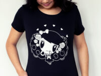 A girl looking down on her Lolligag Day of the Dead shirt