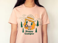 A girl giggling wearing the Lolligag Happy Camper Adult T-shirt