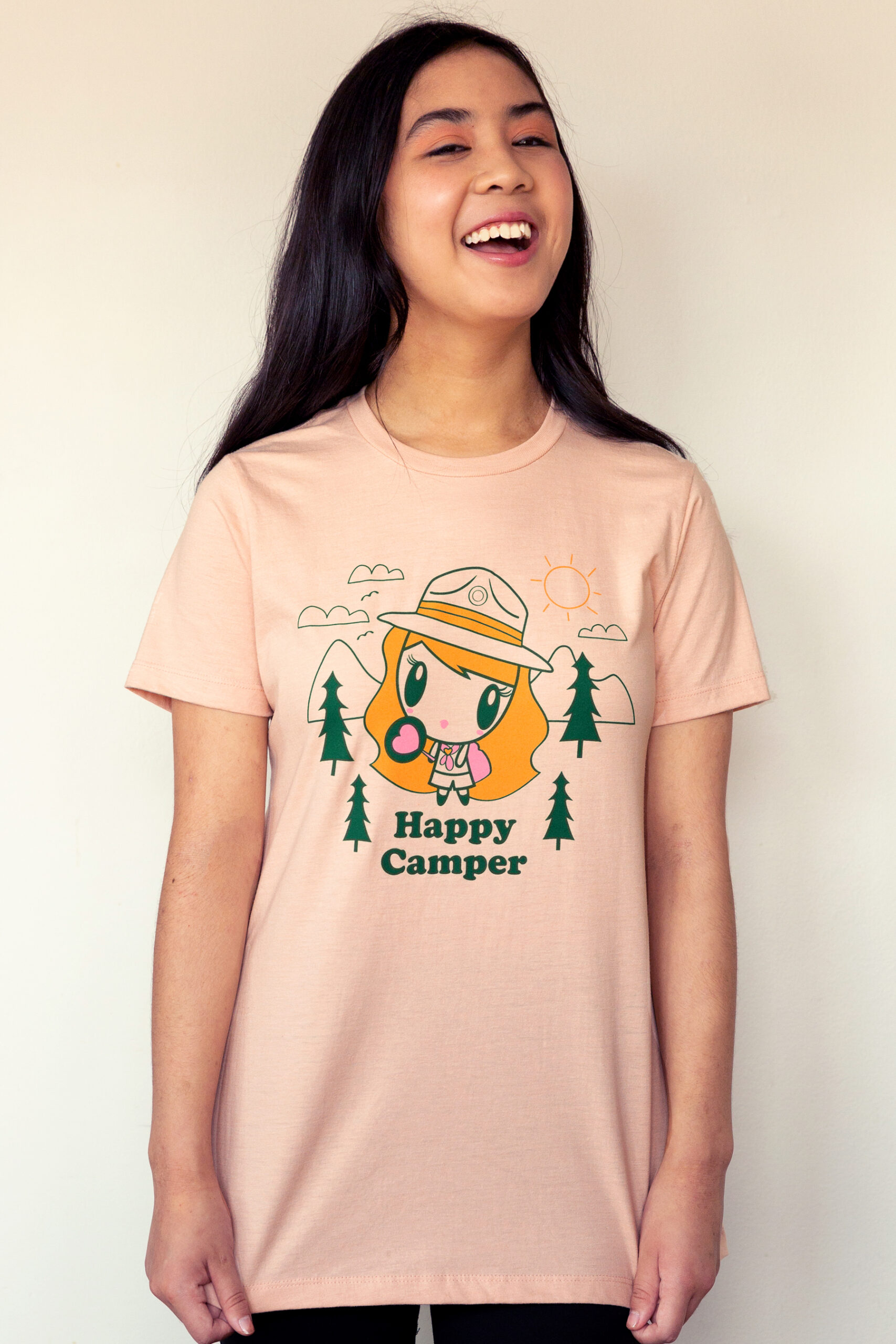 A girl giggling wearing the Lolligag Happy Camper Adult T-shirt