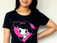 A girl wearing the Dancing Hearts Lolligag Tee