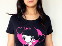 A girl wearing the Dancing Hearts Lolligag Tee