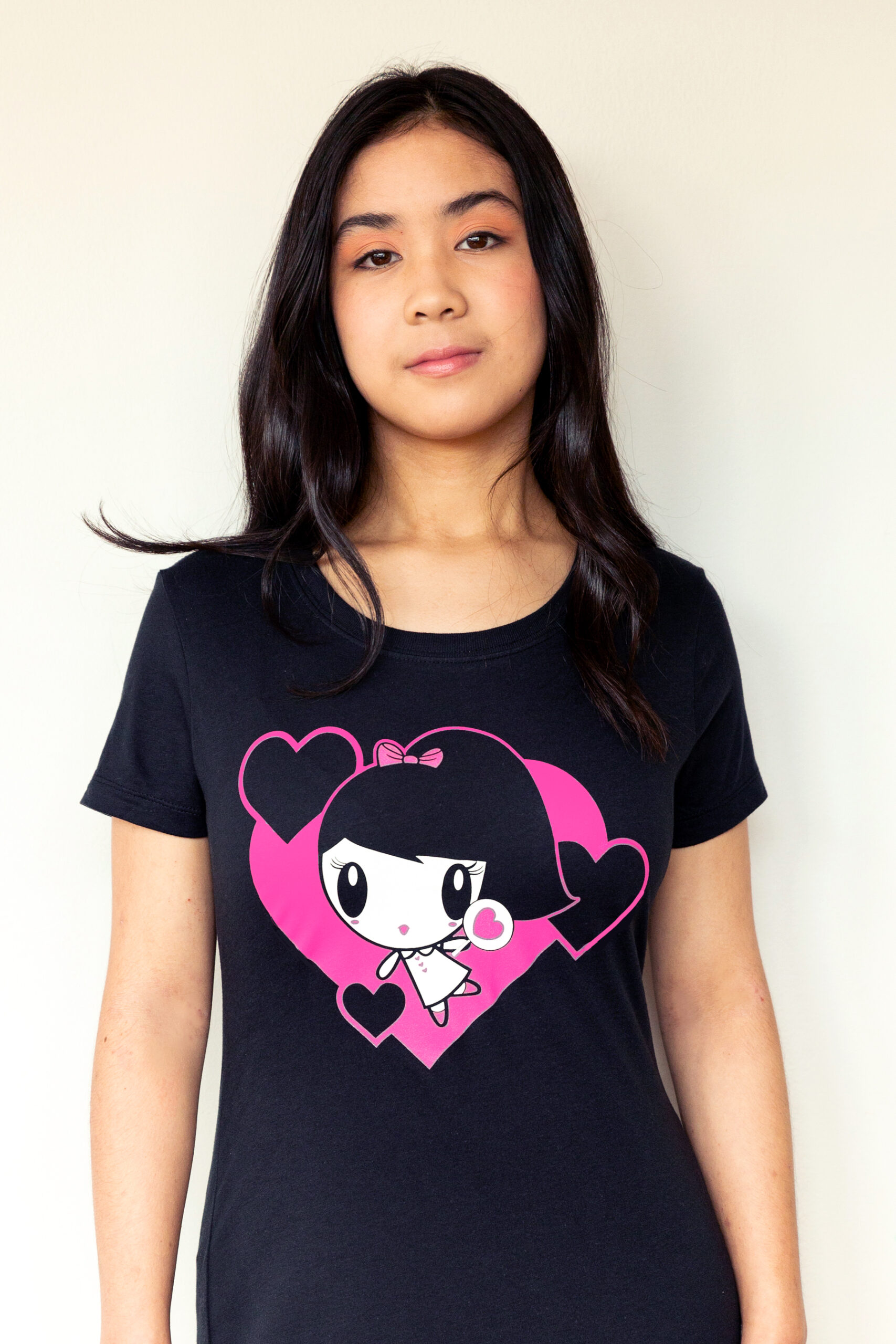 A girl wearing the Dancing Hearts Lolligag Tee