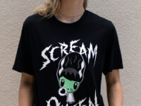 Gen Z smiling and looking up while wearing the Scream Queen Lolligag T-shirt