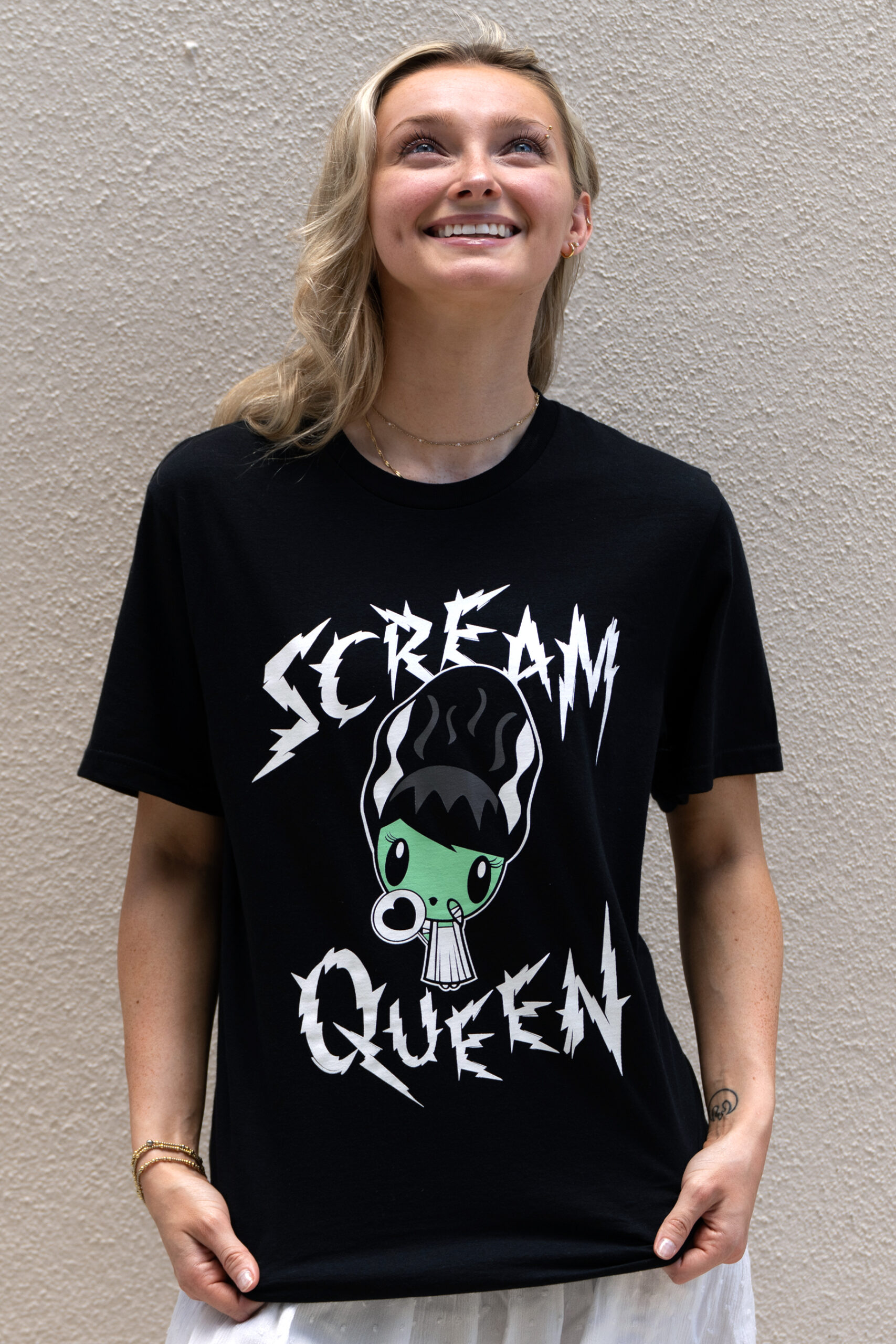 Gen Z smiling and looking up while wearing the Scream Queen Lolligag T-shirt