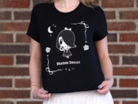 Young woman wearing the Lolligag Shadow Dancer tee
