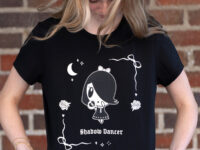 Millennial looking down at the Lolligag Shadow Dancer tee