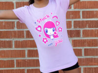 Girl with arms outstretched wearing the Stuck on You Lolligag tee