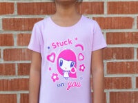 Girl smiling wearing the Stuck on You Lolligag tee