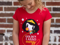 Girl wearing the Lolligag Golden Lasso Energy kids tee