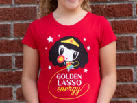 Girl wearing the Golden Lasso Energy Lolligag kids tee
