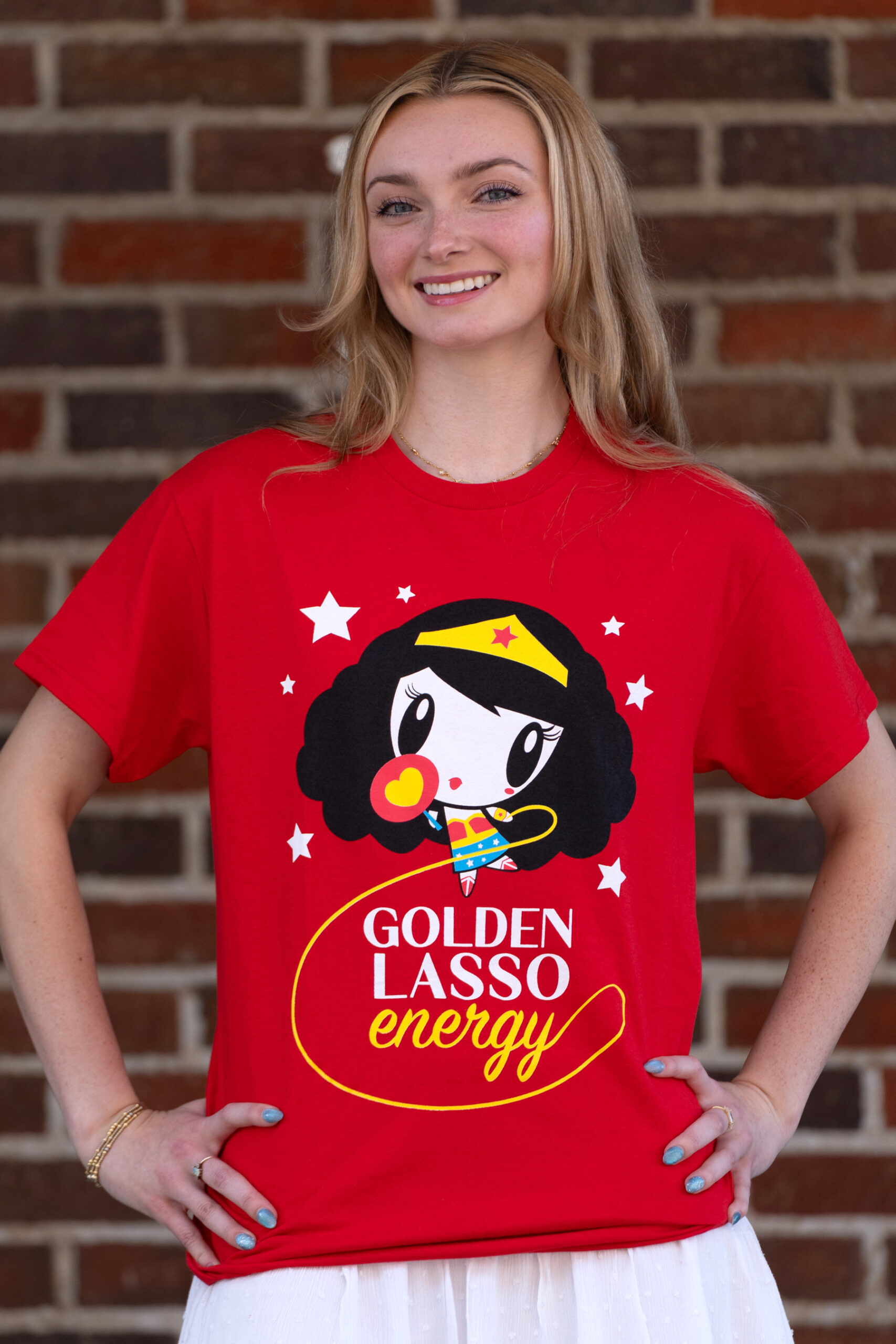 Millennial wearing the Lolligag Golden Lasso Energy Tee