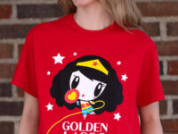 Young adult laughing while wearing the Lolligag Golden Lasso Energy Tee