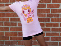 Girl with arms outstretched wearing the Wild Child Lolligag Tee