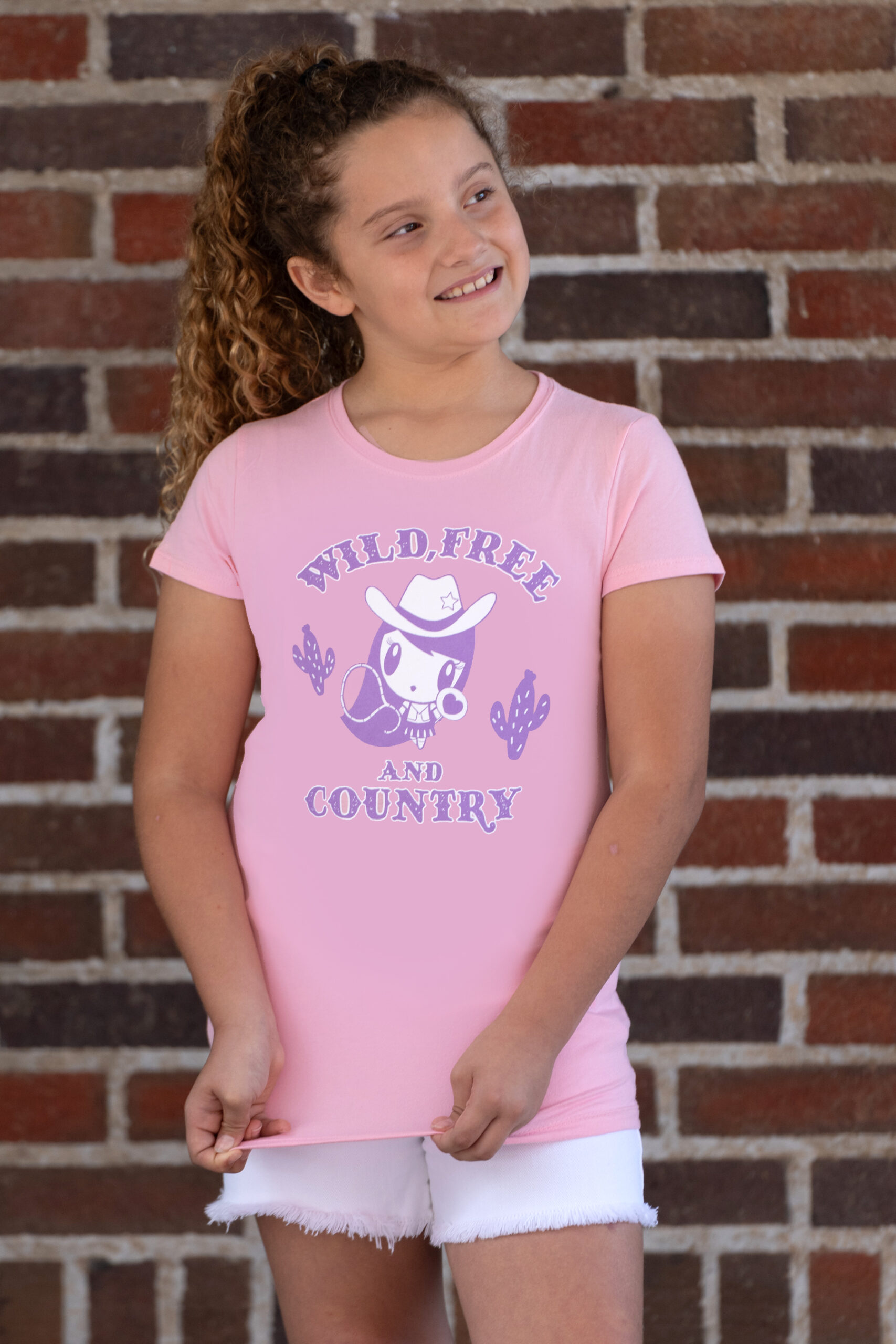 Girl wearing the Wild, Free and Country Lolligag Kids tee