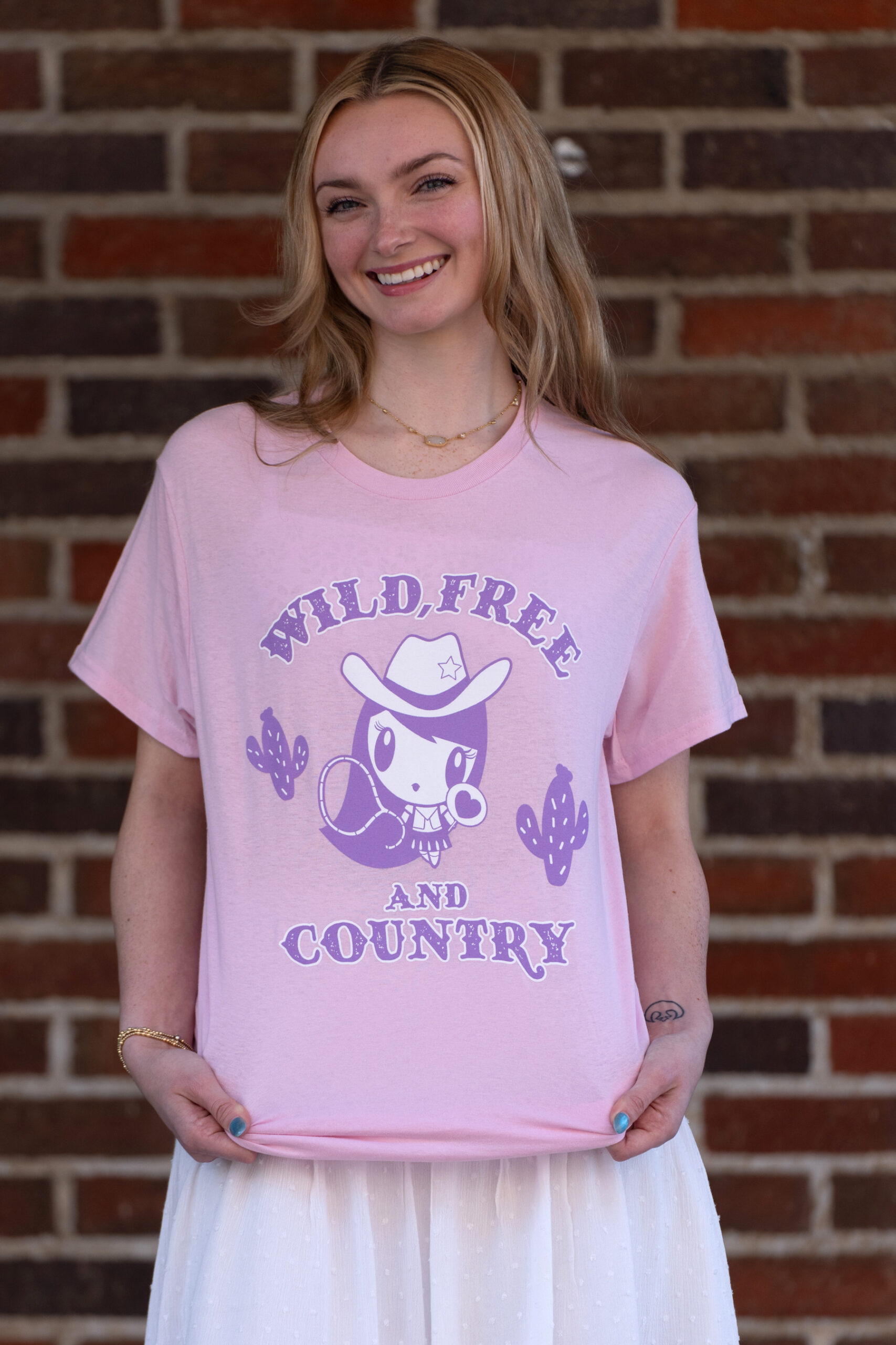 Millennial wearing the Wild, Free and Country Lolligag Tee